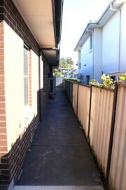 side gate corridor of house, showing ease of access to rear of house if needed.